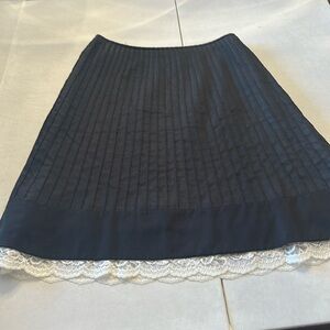 Ann Taylor Size 0 Petite Black Skirt with white lace bottom trim.